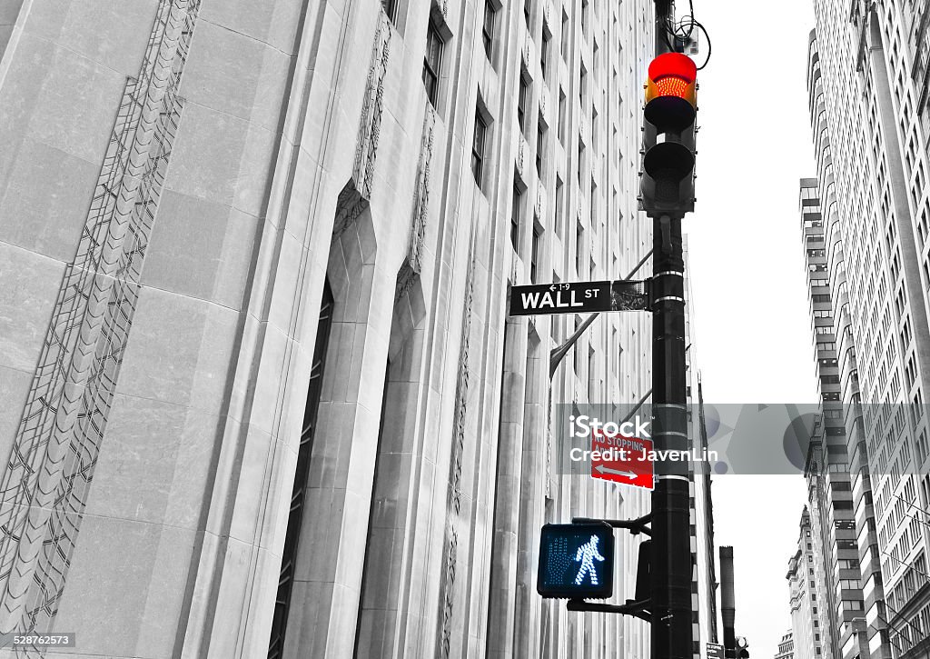 Wall Street road sign and traffic lights Wall Street road sign and traffic lights. Wall Street - Lower Manhattan Stock Photo