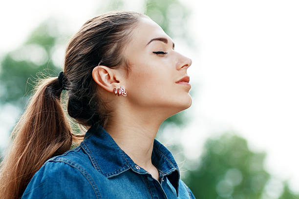 woman breathing fresh air