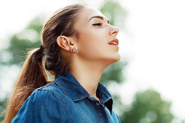 istock woman breathing fresh air 528763671