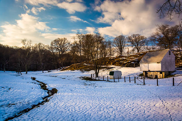 Barn and snow-covered field in rural Baltimore County, Maryland.