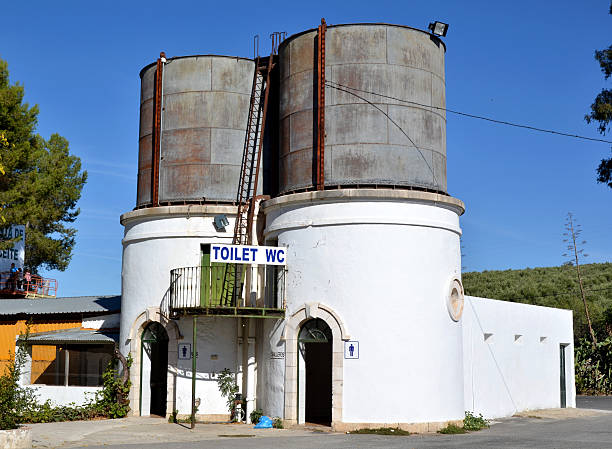 Old water tanks in abandoned station Old water tanks in abandoned station and converted into greenway. Luque Station. Córdoba. Spain. via verde spain stock pictures, royalty-free photos & images