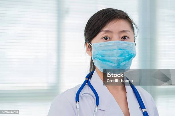 Woman Doctor With A Mask Stock Photo - Download Image Now - 30-39 Years, Adult, Adults Only