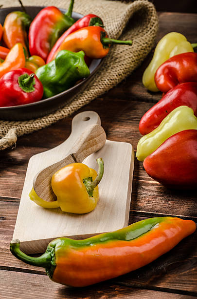 istock Slicing peppers with wood knife 528766415