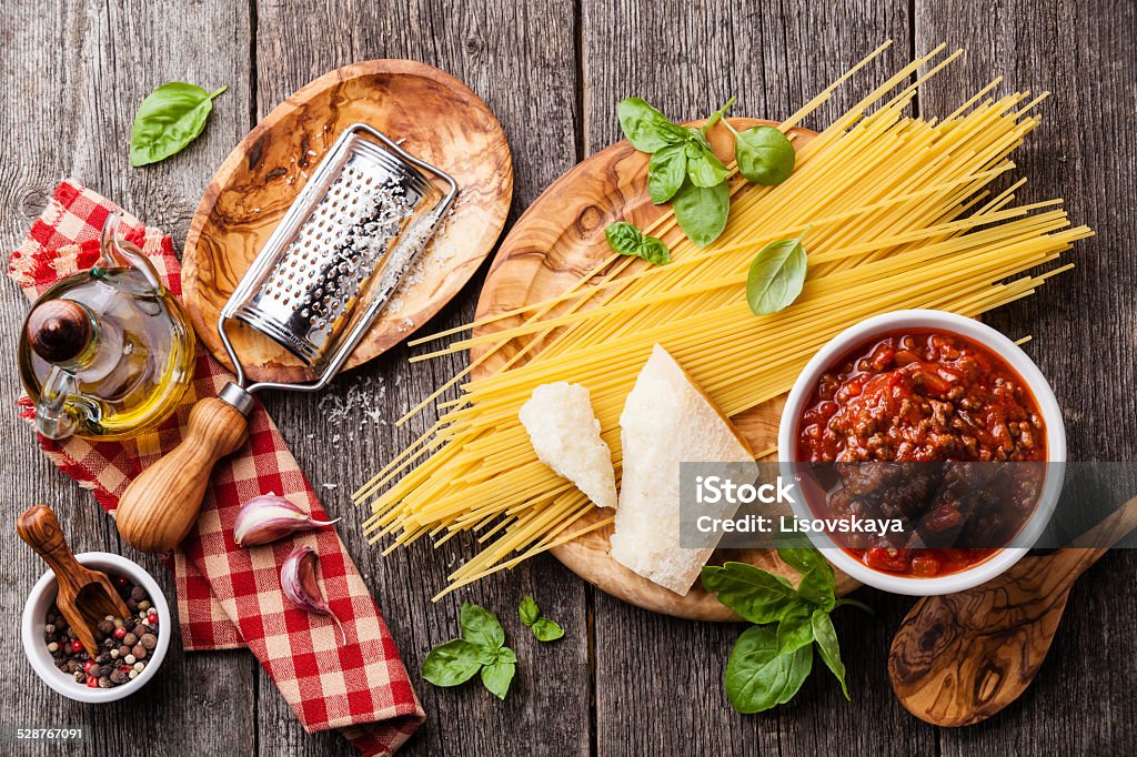 Ingredients for spaghetti bolognese Ingredients for spaghetti bolognese on gray wooden background Bolognese Sauce Stock Photo