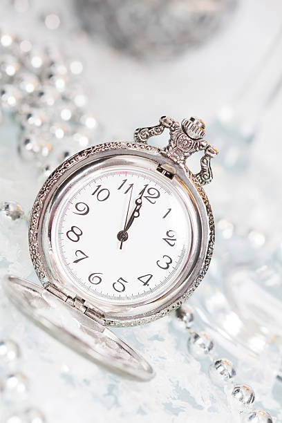 istock Old silver clock close to midnight and Christmas decorations 528776275