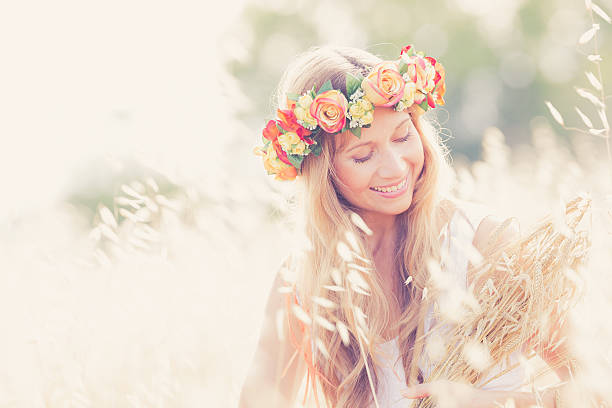 A holiday in the city. A girl in a wreath of herbs at the Ivan Kupala holiday.