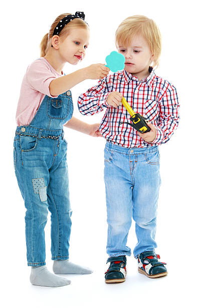 istock Girl and boy looking in the mirror. 528776641