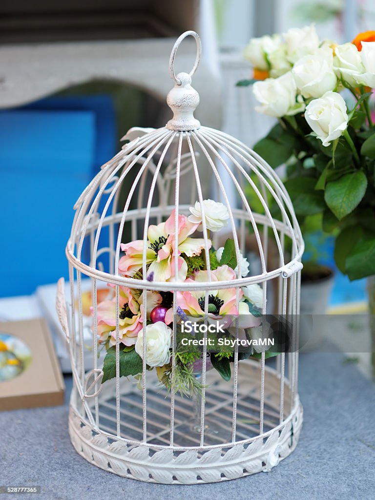 White cage with flowers White cage with flowers as decoration on wedding Arts Culture and Entertainment Stock Photo