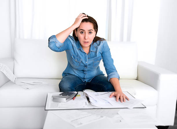 istock young woman at home in stress desperate in financial problems 528778705