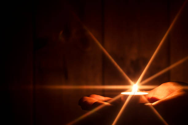 istock Hand holding candle with Glowing Star - Christmas Light Hope 528780243