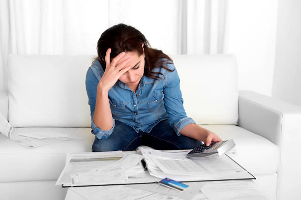 istock young woman at home in stress desperate in financial problems 528781421