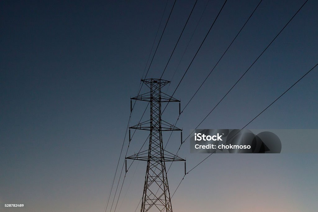 High voltage High voltage electricity pylon In the evening Back Lit Stock Photo