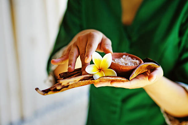 istock Balinese masseuse with spa-treatment ingredients 528783229