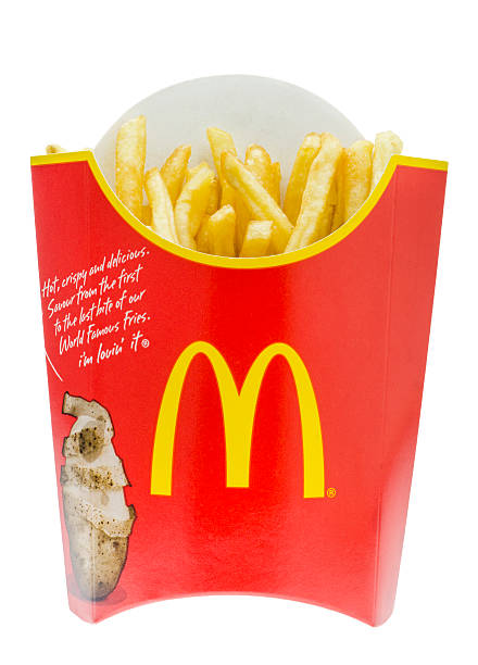 London, England - November 14, 2014: McDonald's French Fries, Founded in 1940 by Richard and Maurice McDonald is now the largest chain of Fast Food Restaurants in the world.