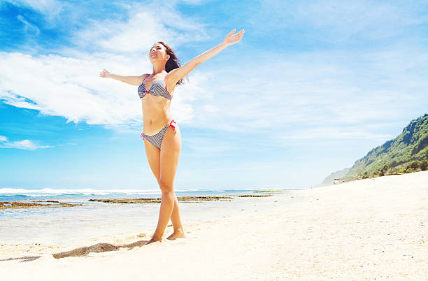 istock Happy woman on the beach 528795707