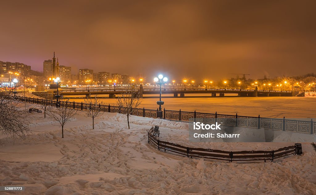 River promenade in Donetsk city on a winter. River promenade in a small german town on a winter Christmas night Bridge - Built Structure Stock Photo