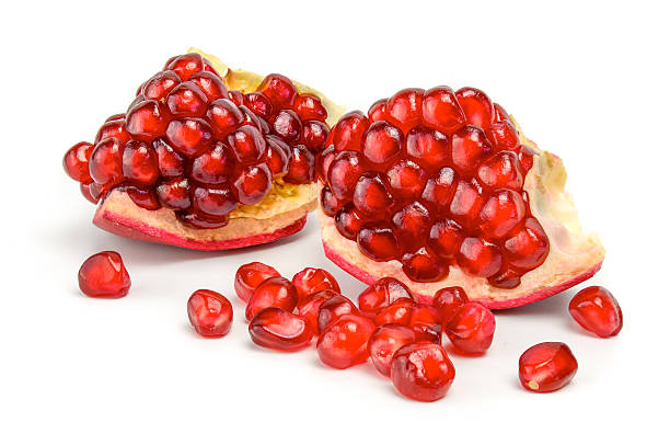istock Ripe pomegranate fruit isolated on white background cutout 528812535