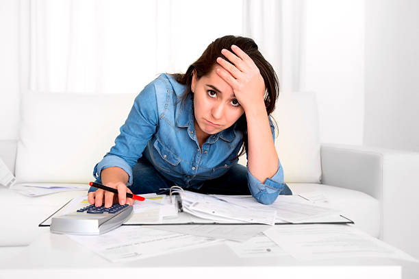 istock young woman at home in stress desperate in financial problems 528815295