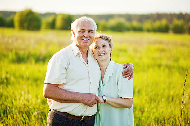 istock Senior couple standing in a field 528825919