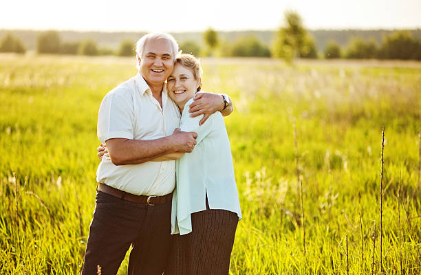 istock Senior couple standing in a field 528826485