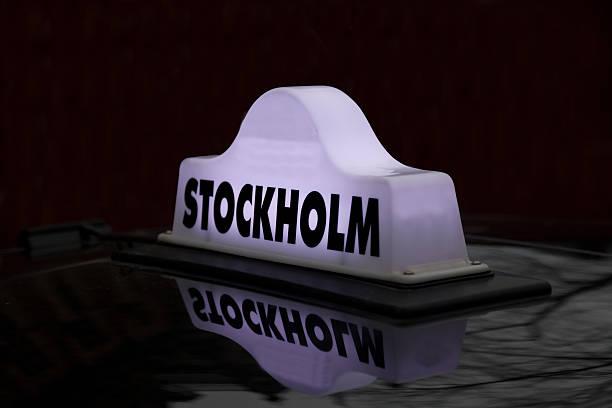 istock taxi cap on a car roof 528827001