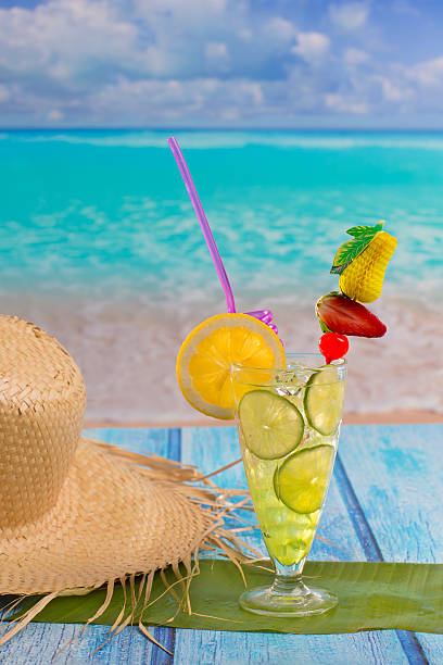 istock Lemon lime cocktail mojito on tropical beach 528829499