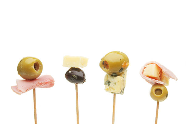 Olive, cheese and ham party nibbles on cocktail sticks