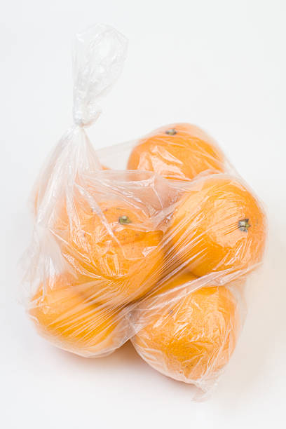 istock Mandarins in the polyethylene bag isolated 528832381
