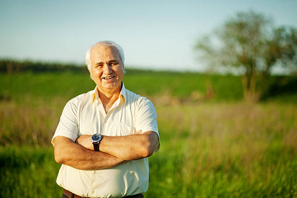 istock Senior man standing in a field 528832853