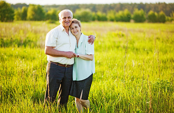 istock Senior couple standing in a field 528863181