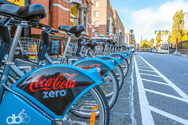 Dublin Bikes Dublin, Ireland - Oct 25, 2014: Cocacola new sponsor of Dublin bikes parked on Nassay street in Dublin, Ireland on October 25, 2014 coke zero photos stock pictures, royalty-free photos & images