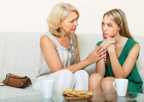 istock Mother gives solace to daughter 528864283