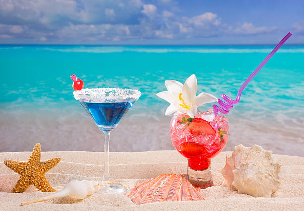 istock Beach tropical red and blue cocktail on caribbean white sand 528864721