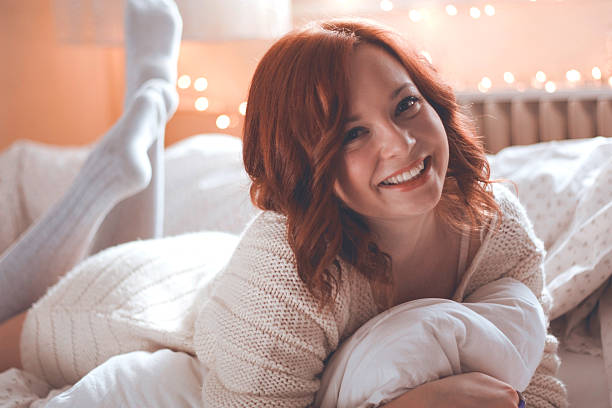 istock Redhead women smiling in morning bed 528865569