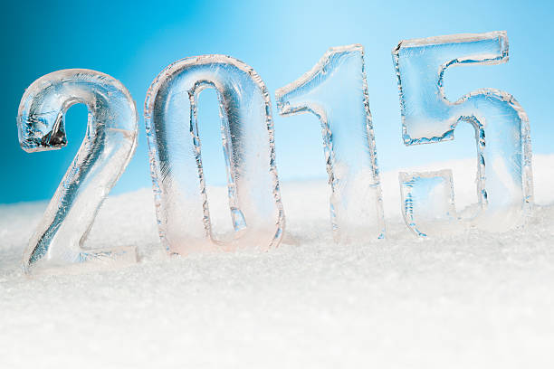 istock Year 2015 cut from ice on snow blue sunny background 528876811