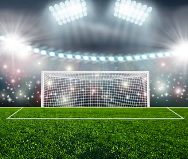 istock Soccer ball on green stadium arena 528877425