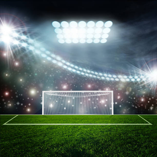 istock Soccer ball on green stadium arena 528877437
