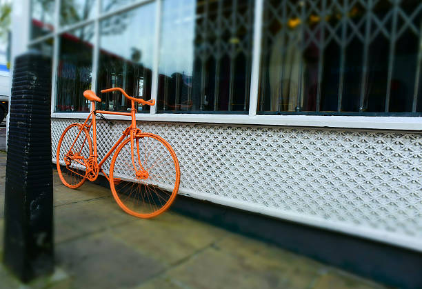 istock Lone Orange Bicycle in London 528877723