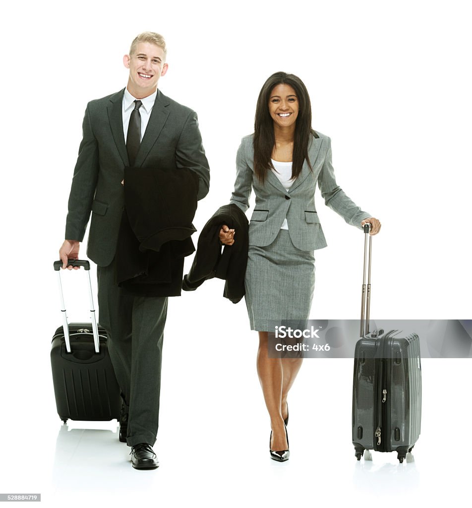 Happy business couple walking & holding trolley bag Happy business couple walking & holding trolley baghttp://www.twodozendesign.info/i/1.png 18-19 Years Stock Photo