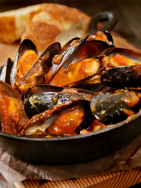 Mussels in Tomato Sauce with Fresh Parsley and Bread -Photographed on Hasselblad H3D2-39mb Camera