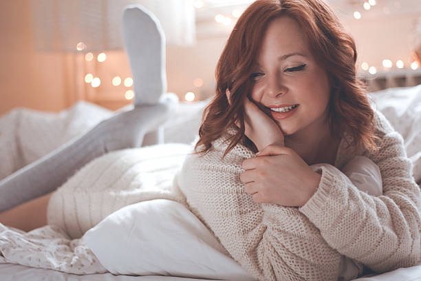 istock Redhead women smiling in morning bed 528886763