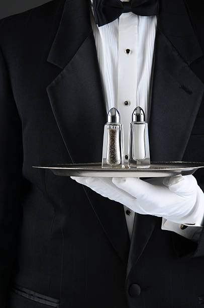 istock Waiter Holding Tray with Salt and Pepper 528887771