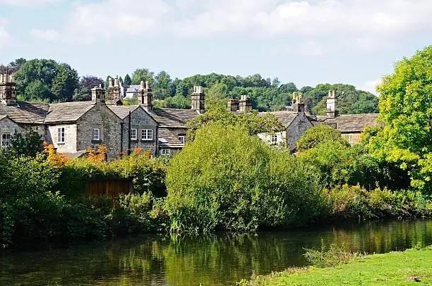 Cottages alongside the River Wye, Bakewell, Derbyshire, England, UK, Western Europe.
