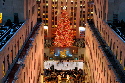New York, NY. USA - February 15, 2005: New York City landmark, Ice skaters and tourists visit the famous Rockefeller Center Christmas tree during the holidays.