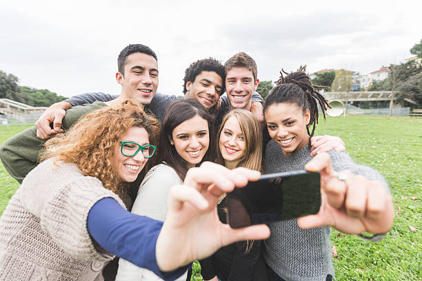 istock Multiethnic Group of Friends Taking Selfie at Park 528890059