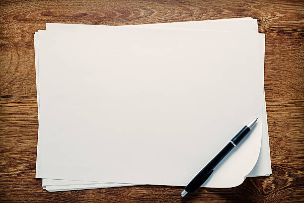 istock Ballpoint pen lying on sheets of paper 528890857