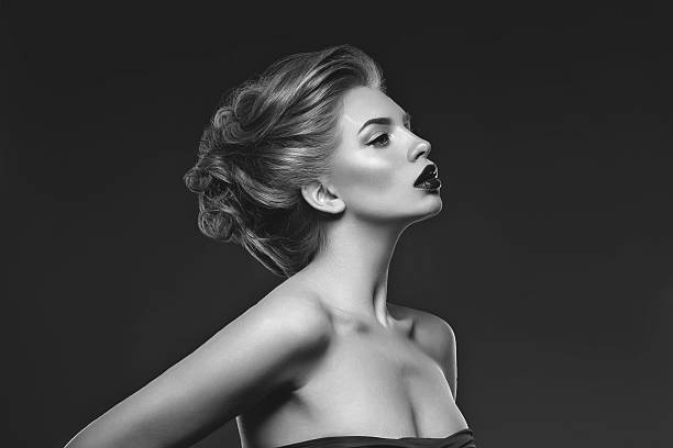 istock Girl with dark lips and hairdo 528891370