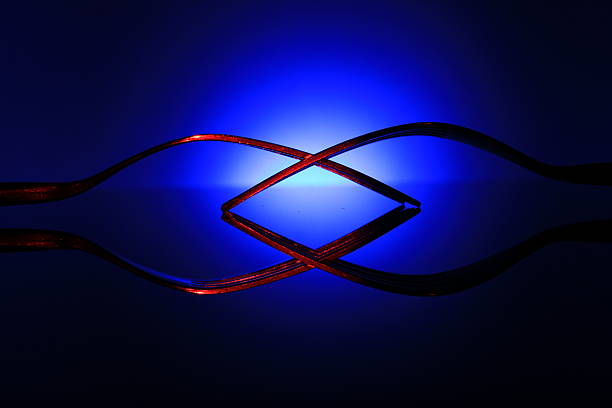 Red Forks Reflecting On Blue Background. stock photo