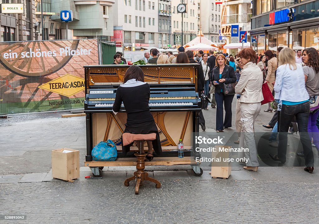 famous classical piano player SoRyang plays the piano Vienna, Austria - April 22, 2009: famous classical piano player SoRyang plays the piano also in pedestrian zones to make people interrested in piano concerts. Adult Stock Photo