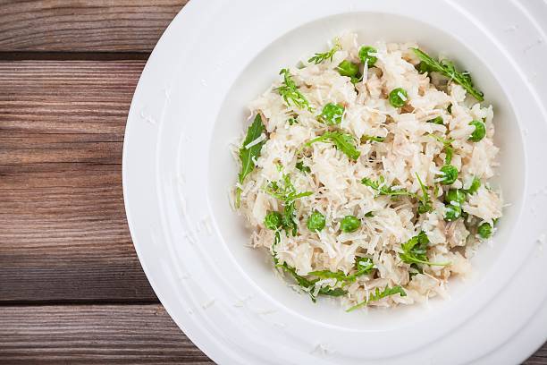 istock Homemade risotto with chicken, green peas, arugula and parmesan 528893884